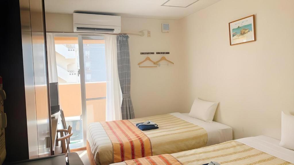 Hotel Peace Land Kume Naha Esterno foto
