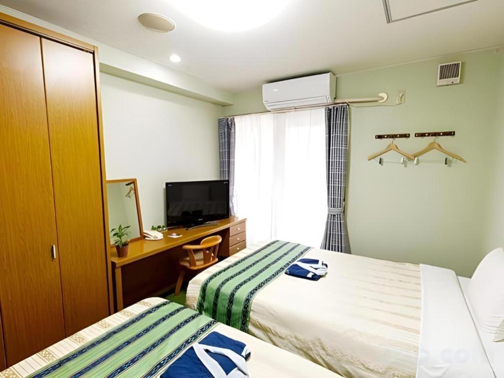 Hotel Peace Land Kume Naha Esterno foto