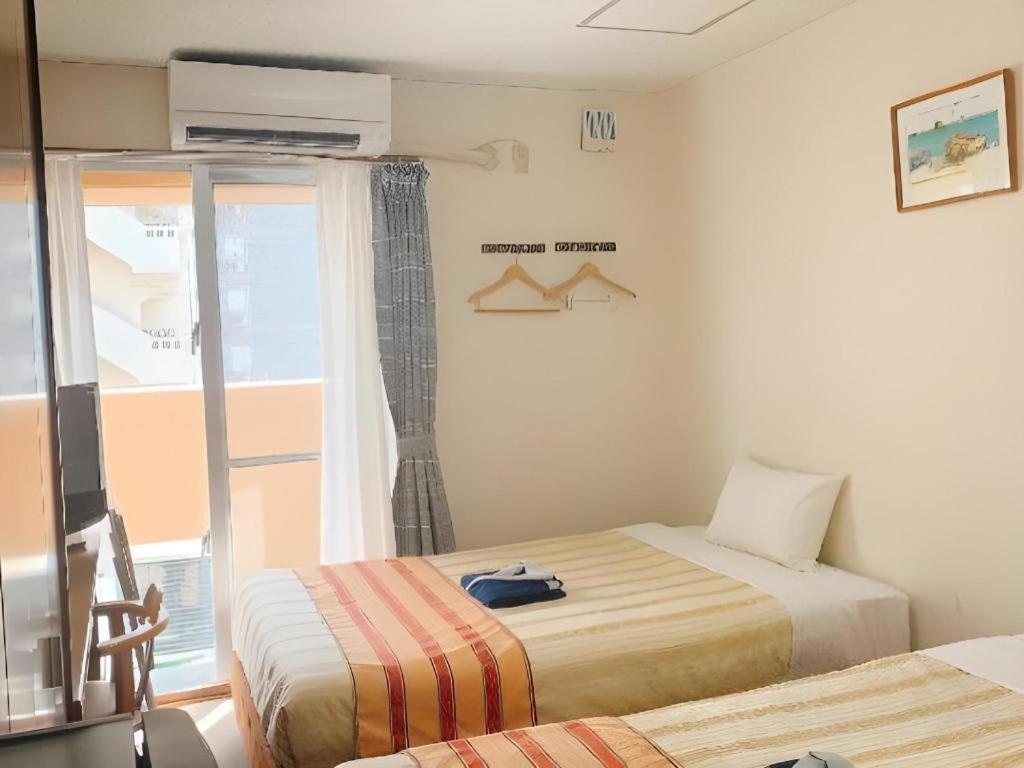 Hotel Peace Land Kume Naha Esterno foto