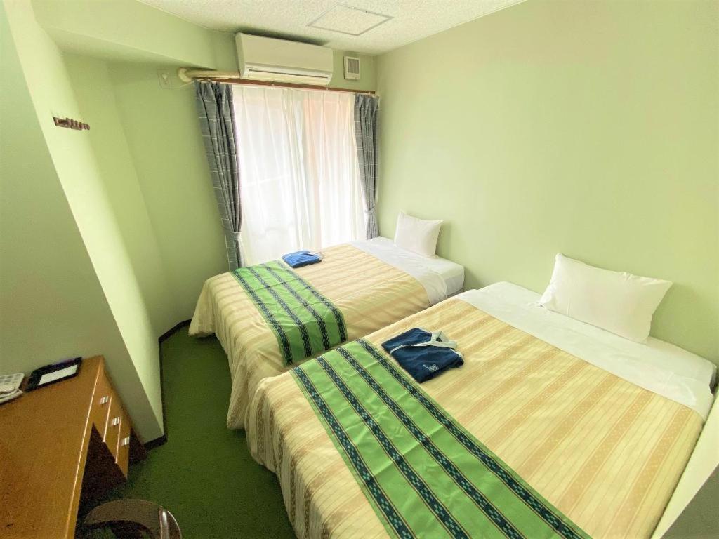 Hotel Peace Land Kume Naha Esterno foto